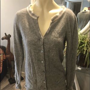 100% cashmere.  Designed in France.